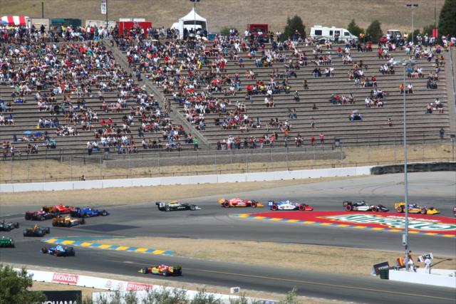 The field rolls onto the front stretch -- Photo by: Chris Jones