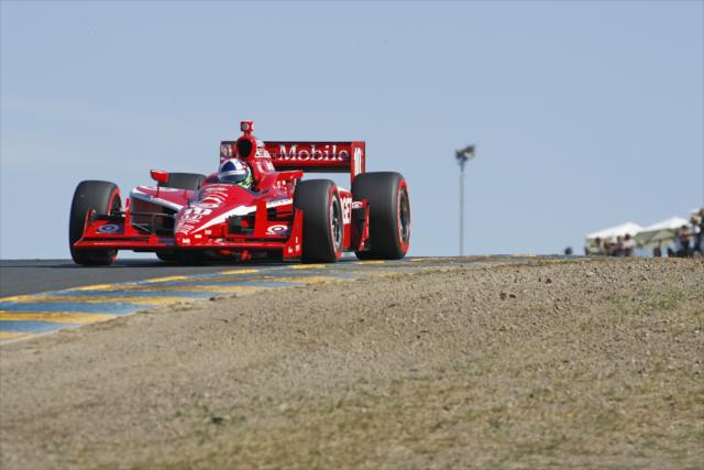 Dario Franchitti races over the hill in Sonoma -- Photo by: Richard Dowdy