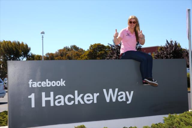 Pippa Mann sits atop the Facebook headquarters sign in Palo Alto, CA -- Photo by: Chris Jones