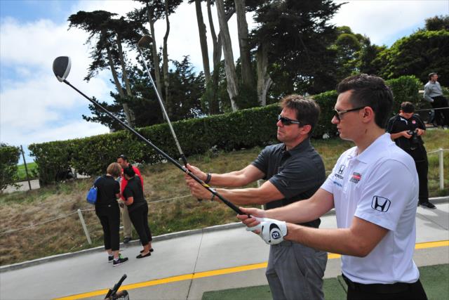 Mikhail Aleshin gets a quick golf lesson at the Presidio Golf Course in San Francisco, CA -- Photo by: John Cote