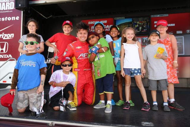 Some young fans get a photo with Sebastian Saavedra in the INDYCAR Fan Village at Sonoma Raceway -- Photo by: Chris Jones