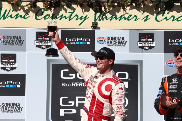 Scott Dixon performs the traditional wine toast after winning the GoPro Grand Prix of Sonoma at Sonoma Raceway -- Photo by: Chris Jones