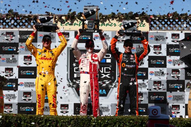 The podium of Scott Dixon, Ryan Hunter-Reay, and Simon Pagenaud hoist their trophies after the GoPro Grand Prix of Sonoma at Sonoma Raceway -- Photo by: Chris Jones