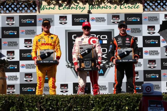 The podium of Scott Dixon, Ryan Hunter-Reay, and Simon Pagenaud with their trophies in Victory Lane at Sonoma Raceway -- Photo by: Chris Jones