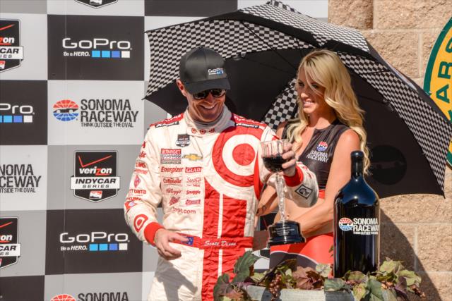 Scott Dixon with the celebratory glass of wine in Victory Circle after winning the GoPro Grand Prix of Sonoma at Sonoma Raceway -- Photo by: John Cote