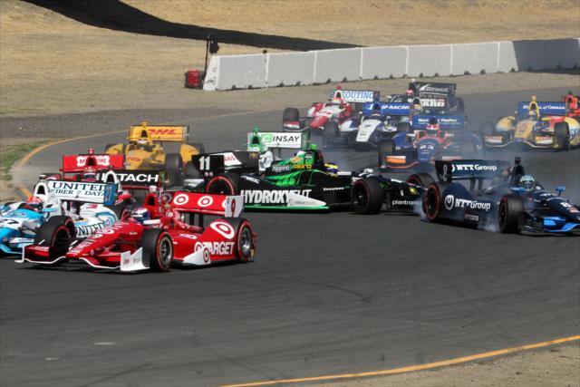 The field scatter as they avoid the cars of Sebastien Bourdais and Ryan Briscoe at Sonoma Raceway -- Photo by: Richard Dowdy
