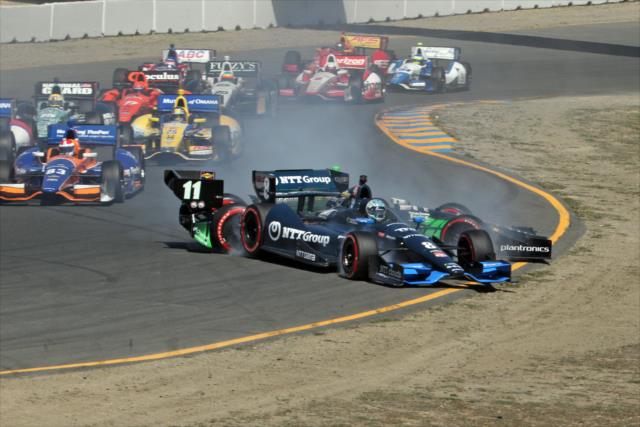 The cars of Ryan Briscoe and Sebastien Bourdais go off course during the start of the GoPro Grand Prix of Sonoma at Sonoma Raceway -- Photo by: Richard Dowdy