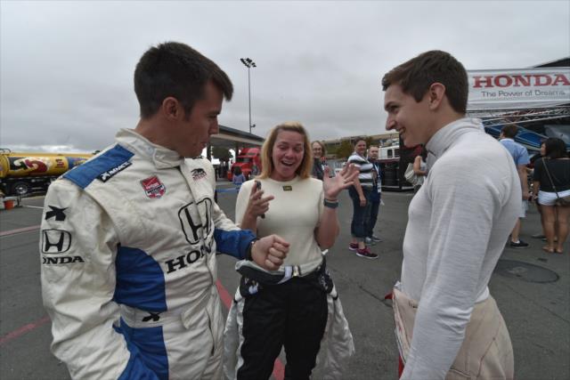 Sarah Fisher chats with drivers Martin Plowman and Zach Veach prior to taking the two-seaters out at Sonoma Raceway -- Photo by: John Cote