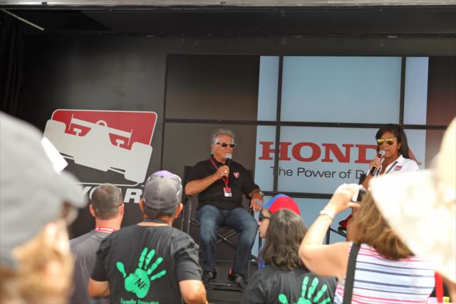 Mario Andretti answers a question during a Q&A session in the INDYCAR Fan Village at Sonoma Raceway -- Photo by: Richard Dowdy