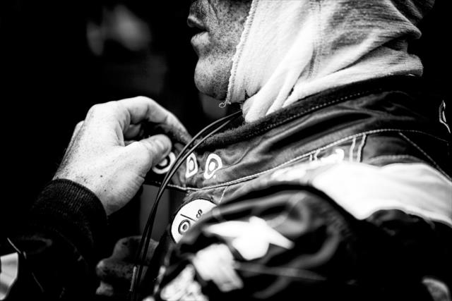 Scott Dixon adjusts his firesuit prior to practice for the GoPro Grand Prix of Sonoma at Sonoma Raceway -- Photo by: Shawn Gritzmacher