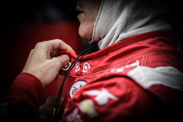 Scott Dixon adjusts his firesuit on pit lane prior to practice for the GoPro Grand Prix of Sonoma at Sonoma Raceway -- Photo by: Shawn Gritzmacher