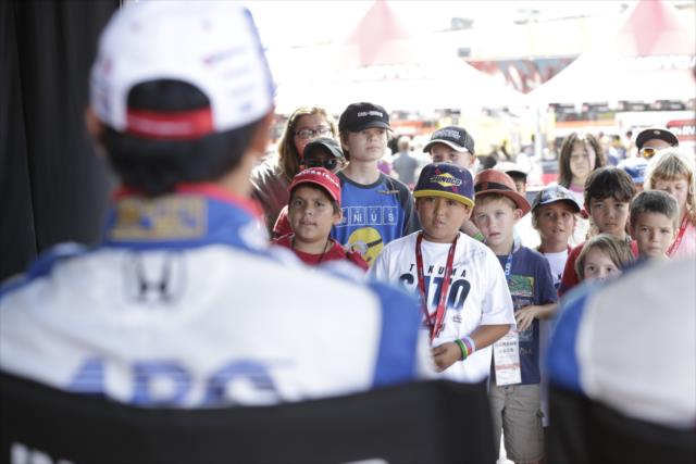 Young fans listen in on a special Q&A session for them by Takuma Sato in the INDYCAR Fan Village at Sonoma Raceway -- Photo by: Shawn Gritzmacher