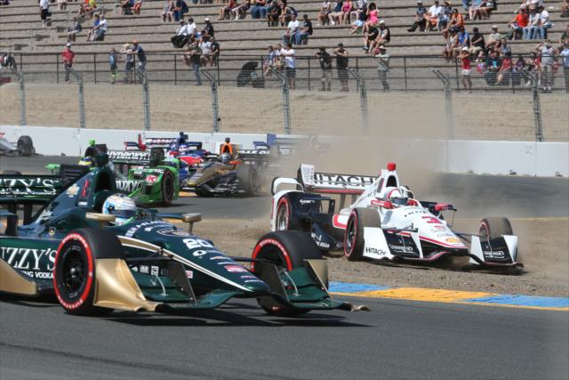 Helio Castroneves goes off-course as the field streams by during the opening lap of the GoPro Grand Prix of Sonoma at Sonoma Raceway -- Photo by: Chris Jones