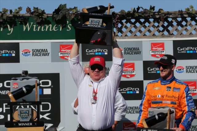 Chip Ganassi hoists the winning team owner's trophy for the GoPro Grand Prix of Sonoma at Sonoma Raceway -- Photo by: Chris Jones