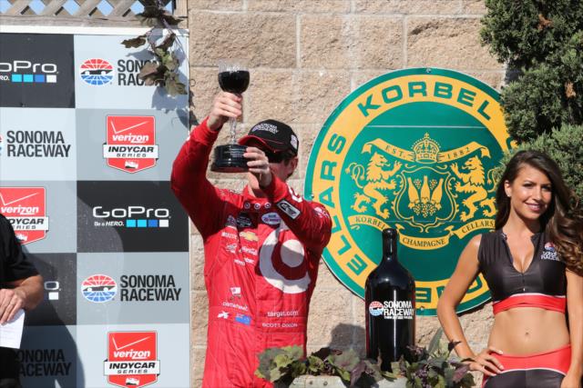Scott Dixon hoists the winner's wine goblet in Victory Circle after winning the GoPro Grand Prix of Sonoma at Sonoma Raceway -- Photo by: Chris Jones