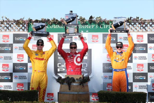The podium of Scott Dixon, Ryan Hunter-Reay, and Charlie Kimball hoist their trophies in Victory Circle following the GoPro Grand Prix of Sonoma -- Photo by: Chris Jones