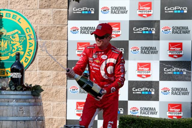 Scott Dixon sprays the champagne in Victory Circle following his win in the GoPro Grand Prix of Sonoma at Sonoma Raceway -- Photo by: Chris Jones