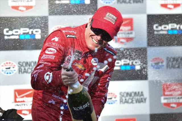 Scott Dixon sprays the champagne in Victory Circle following his win in the GoPro Grand Prix of Sonoma at Sonoma Raceway -- Photo by: Chris Owens