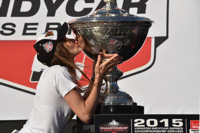 Scott Dixon's wife, Emma, kisses the Astor Cup after he wins the 2015 Verizon IndyCar Series Championship at Sonoma Raceway -- Photo by: John Cote