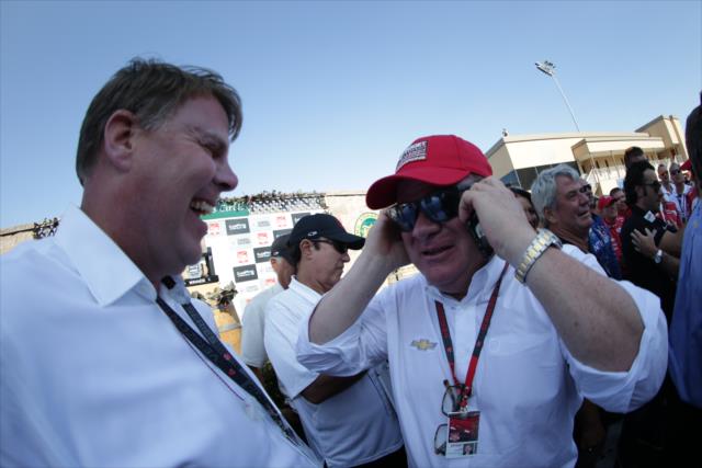 Chip Ganassi is congratulated by Chevrolet's Jim Campbell following clinching the 2015 Verizon IndyCar Series Championship -- Photo by: Shawn Gritzmacher