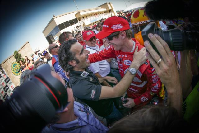 Scott Dixon is congratulated by Dario Franchitti after winning the 2015 Verizon IndyCar Series Championship -- Photo by: Shawn Gritzmacher