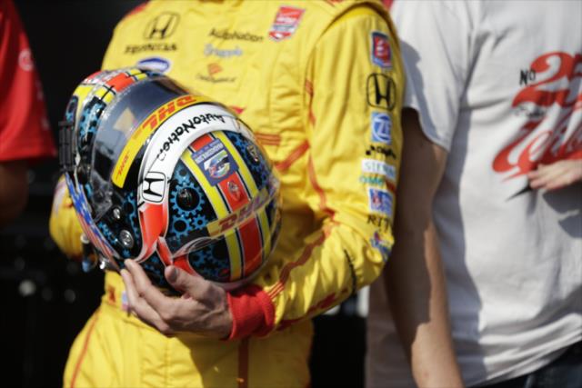 Ryan Hunter-Reay shows the helmet to be auctioned for the Wilson Children's Fund following the GoPro Grand Prix of Sonoma -- Photo by: Shawn Gritzmacher