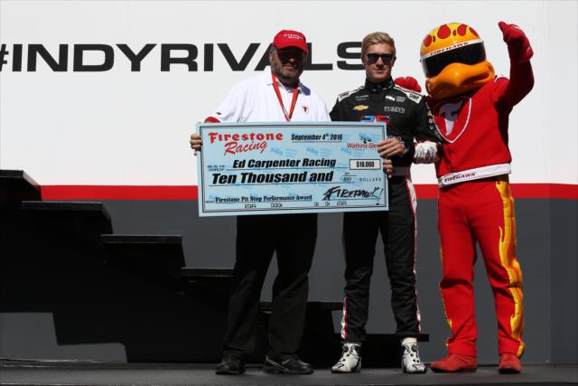 Spencer Pigot accepts the Firestone Pit Stop Performance Award on behalf of Ed Carpenter Racing during pre-race festivities for the GoPro Grand prix of Sonoma -- Photo by: Chris Jones