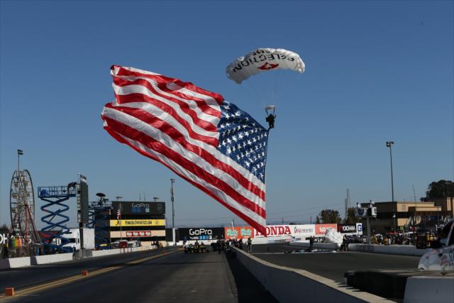 The American Flag comes in for a landing during pre-race festivities for the GoPro Grand prix of Sonoma -- Photo by: Chris Jones