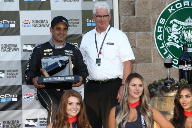 Juan Pablo Montoya accepts his 3rd Place trophy in Victory Lane following the GoPro Grand Prix of Sonoma -- Photo by: Chris Jones