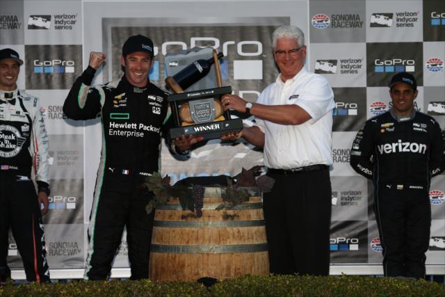 Simon Pagenaud receives the winner's trophy for his victory in the GoPro Grand Prix of Sonoma and becoming the 2016 Verizon IndyCar Series Champion -- Photo by: Chris Jones