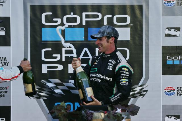 Simon Pagenaud sprays the champagne in Victory Lane following his win in the GoPro Grand Prix of Sonoma -- Photo by: Chris Jones