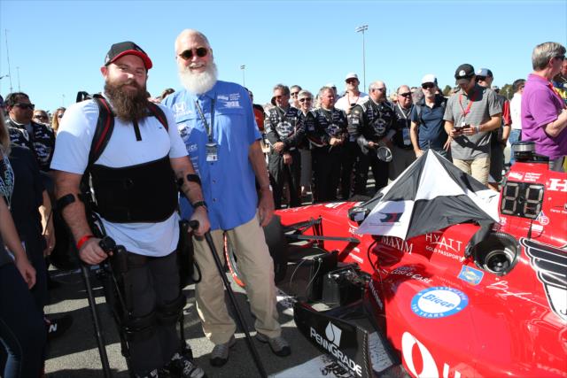 Team co-owner David Letterman stands with veteran Army Sgt. Dan Rose during pre-race festivities for the GoPro Grand prix of Sonoma -- Photo by: Chris Jones