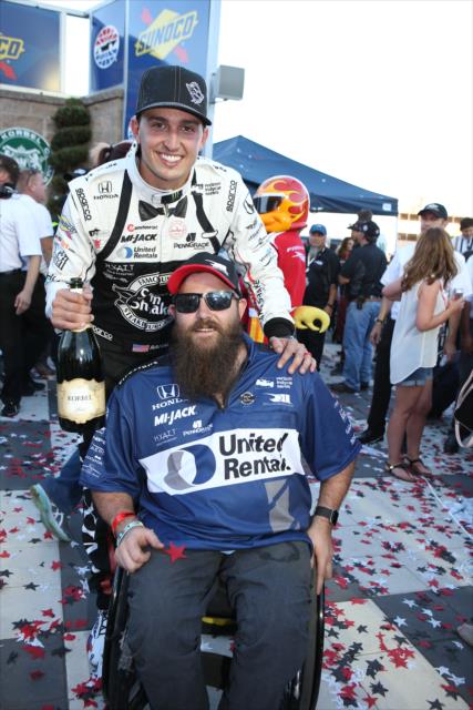 Graham Rahal celebrates with veteran Army Sgt. Dan Rose in Victory Lane following the GoPro Grand Prix of Sonoma -- Photo by: Chris Jones