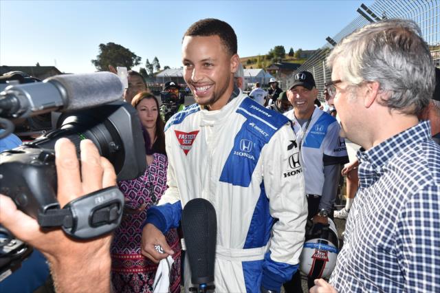 NBA Superstar Stephan Curry is interviewed by the media prior to his two-seater ride at Sonoma Raceway -- Photo by: Chris Owens
