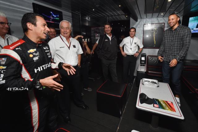 Helio Castroneves and team owner Roger Penske give NBA Star Stephan Curry a tour of the Team Penske transporter at Sonoma Raceway -- Photo by: Chris Owens
