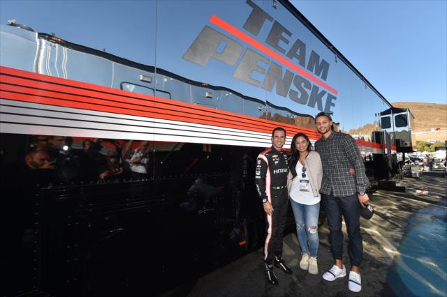 Helio Castroneves pose with Stephan and Ayesha Curry next to the Team Penske transporter at Sonoma Raceway -- Photo by: Chris Owens