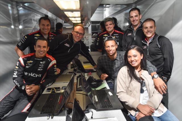 Helio Castroneves and members of the Team Penske crew pose with Grand Marshal Ayesha Curry and NBA star Stephan Curry at Sonoma Raceway -- Photo by: Chris Owens