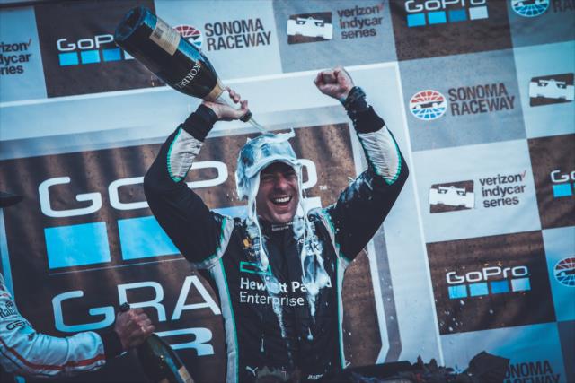 Simon Pagenaud with a champagne shower following his winning the GoPro Grand Prix of Sonoma and the 2016 Verizon IndyCar Series Championship -- Photo by: Joe Skibinski