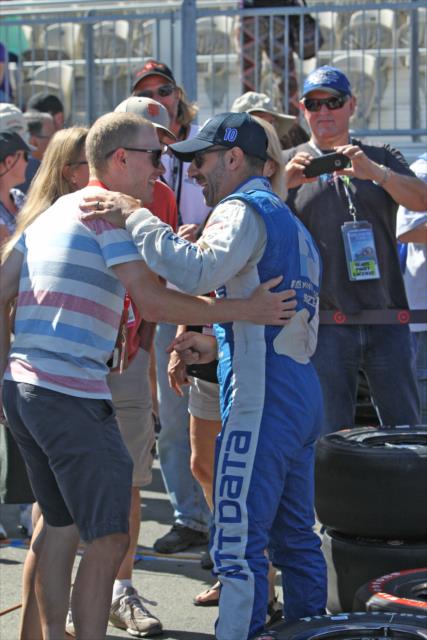 Tony Kanaan chats with a fan on pit lane following the final warmup for the GoPro Grand Prix of Sonoma at Sonoma Raceway -- Photo by: Richard Dowdy