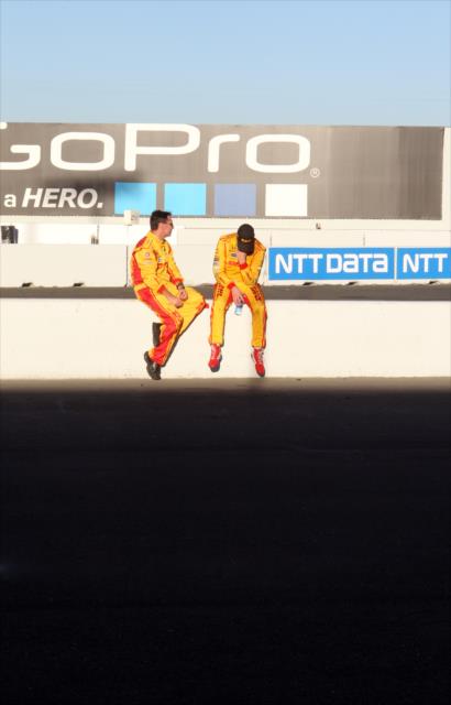 An exhausted Ryan Hunter-Reay chats with his chief engineer along pit lane following the conclusion of the GoPro Grand Prix of Sonoma -- Photo by: Richard Dowdy