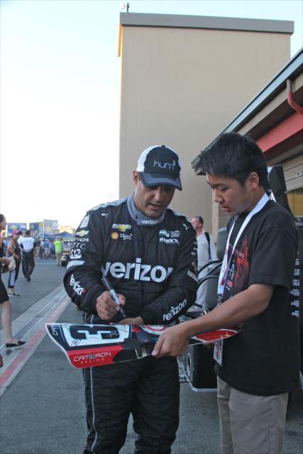 Juan Pablo Montoya signs a karting nosecone following the GoPro Grand Prix of Sonoma -- Photo by: Richard Dowdy