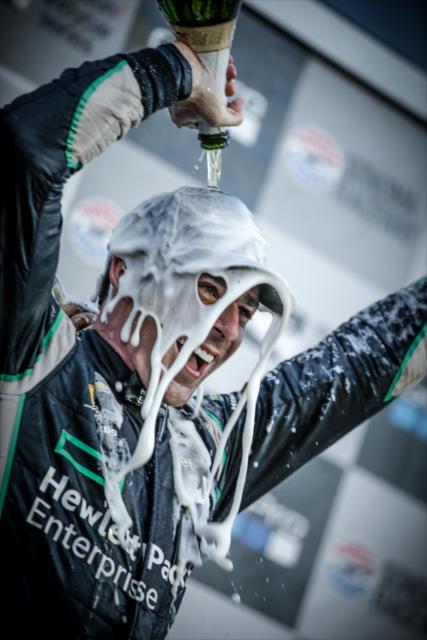 Simon Pagenaud with a champagne shower in Victory Lane following his winning the GoPro Grand Prix of Sonoma and the 2016 Verizon IndyCar Series Championship -- Photo by: Shawn Gritzmacher