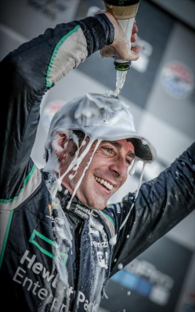 Simon Pagenaud with a champagne shower in Victory Lane following his winning the GoPro Grand Prix of Sonoma and the 2016 Verizon IndyCar Series Championship -- Photo by: Shawn Gritzmacher