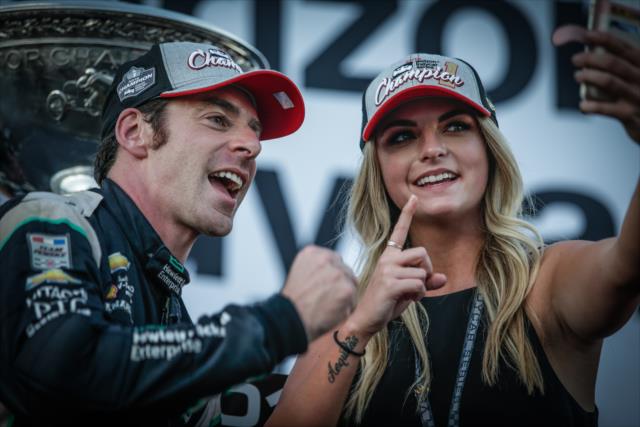 Simon Pagenaud and his girlfriend Hailey take a selfie with the Astor Cup after claiming the 2016 Verizon IndyCar Series Championship -- Photo by: Shawn Gritzmacher
