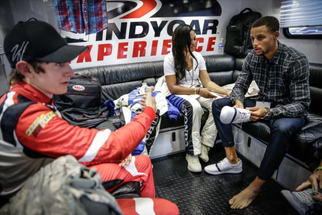 Indy Lights driver Zach Veach chats with Ayesha Curry and Steph Curry prior to their two-seater ride around Sonoma Raceway -- Photo by: Shawn Gritzmacher