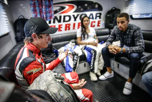 Indy Lights driver Zach Veach chats with Ayesha Curry and Steph Curry prior to their two-seater ride around Sonoma Raceway -- Photo by: Shawn Gritzmacher