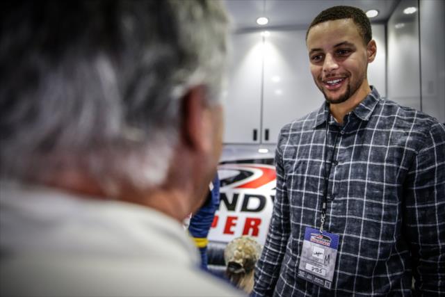 NBA All-Star Steph Curry chats with INDYCAR legend Mario Andretti prior to his two-seater ride around Sonoma Raceway -- Photo by: Shawn Gritzmacher