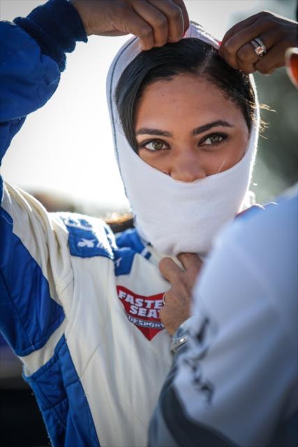 Grand Marshal Ayesha Curry adjusts her balaclava on pit lane prior to her two-seater ride around Sonoma Raceway -- Photo by: Shawn Gritzmacher