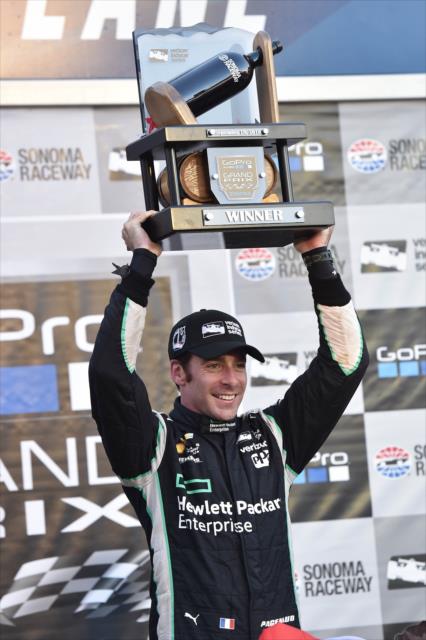 Simon Pagenaud hoists the winner's trophy following his win in the GoPro Grand Prix of Sonoma -- Photo by: Chris Owens