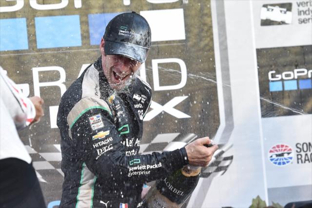 Simon Pagenaud receives a champagne shower in Victory Lane following his win in the the GoPro Grand Prix of Sonoma -- Photo by: Chris Owens